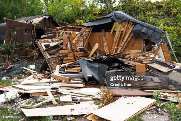 demolition of a wooden hut - collapsing house stock pictures, royalty-free photos & images