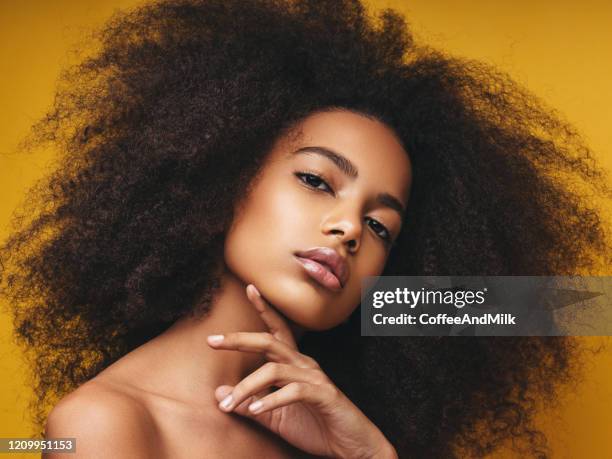 beautiful smiling girl with curly hairstyle - glamorous hair stock pictures, royalty-free photos & images