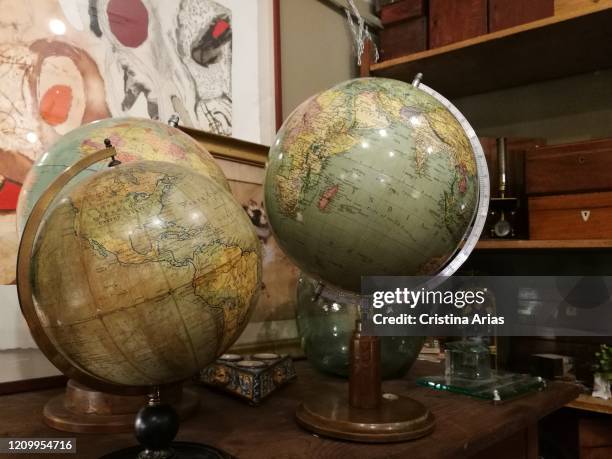 Earth globes for sale in an antique shop in El Rasto in Madrid, Spain.