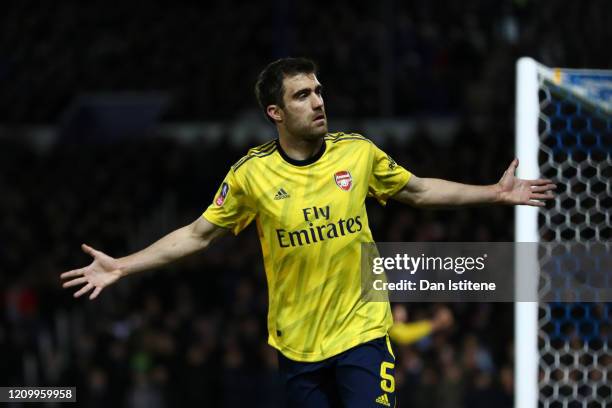 Sokratis Papastathopoulos of Arsenal celebrates after scoring his team's first goal during the FA Cup Fifth Round match between Portsmouth FC and...