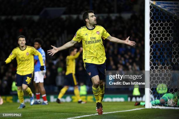 Sokratis Papastathopoulos of Arsenal celebrates after scoring his team's first goal during the FA Cup Fifth Round match between Portsmouth FC and...