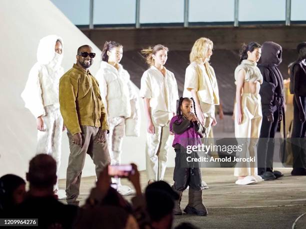 Kanye West and daughter North West on the runway of the Yeezy fashion show during Paris Fashion Week Womenswear Fall/Winter 2020/2021 on March 02,...