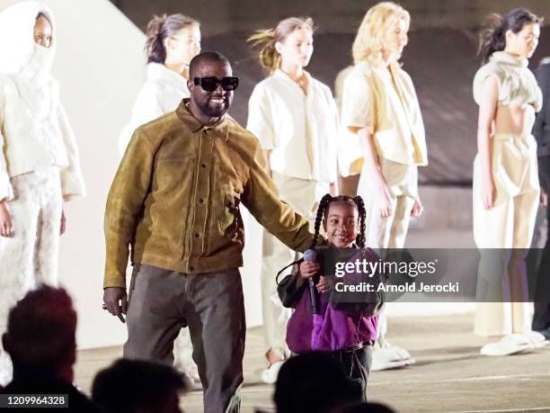 Kanye West and daughter North West on the runway of the Yeezy fashion show during Paris Fashion Week Womenswear Fall/Winter 2020/2021 on March 02,...