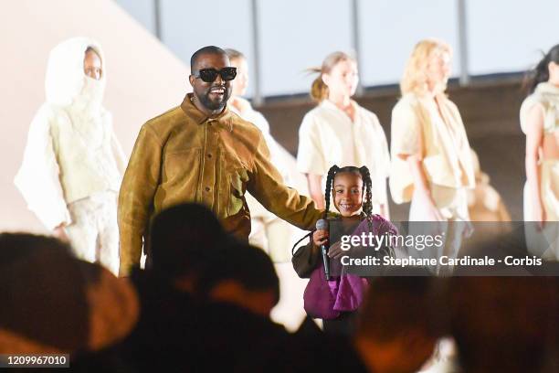 Kanye West and his daughter North West who sings on the runway during the "Yeezy Season 8" show as part of the Paris Fashion Week Womenswear...
