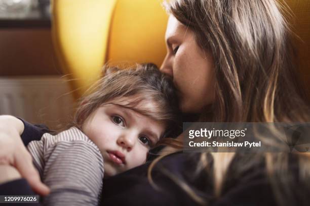 mother hugs sad daughter - family with one child fotografías e imágenes de stock