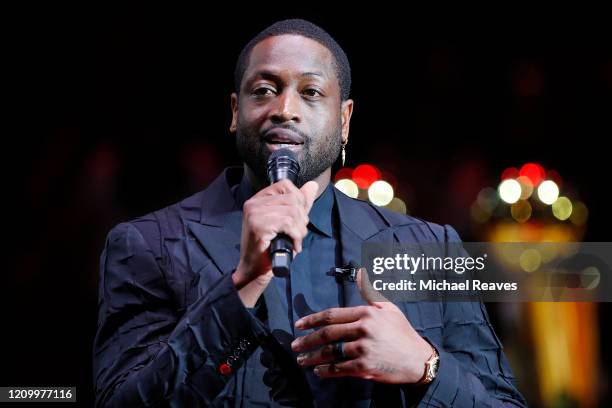 Former Miami Heat player Dwyane Wade addresses the crowd during his jersey retirement ceremony at American Airlines Arena on February 22, 2020 in...