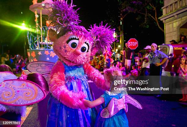 Abby Cadabby finds a look-alike to dance with along the parade route at Sesame Place Thursday, Aug.4, 2011 in Langhorne, PA. Photo by Katherine...