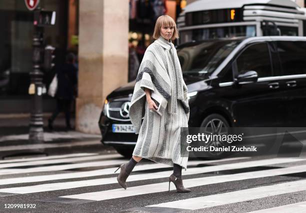 Guest is seen wearing a Giambattista Valli gray outfit outside the Giambattista Valli show during Paris Fashion Week: AW20 on March 02, 2020 in...