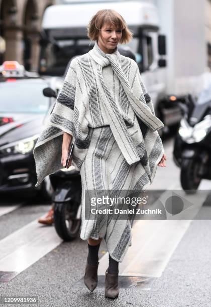 Guest is seen wearing a Giambattista Valli gray outfit outside the Giambattista Valli show during Paris Fashion Week: AW20 on March 02, 2020 in...