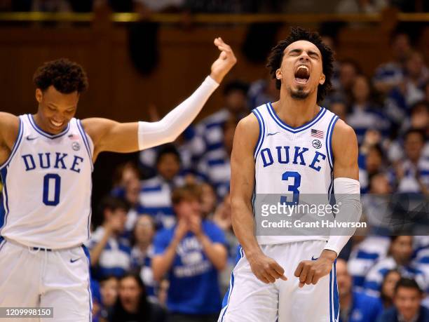 Wendell Moore Jr. #0 and Tre Jones of the Duke Blue Devils react during the second half of their game against the North Carolina State Wolfpack at...