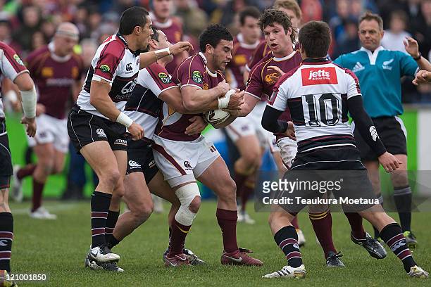 Kade Poki of Southland is tackled during the round nine ITM Cup match between Southland and North Harbour at Rugby Park on August 13, 2011 in...