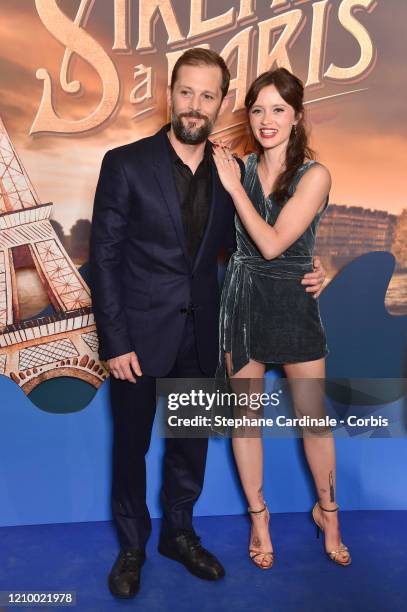 Nicolas Duvauchelle and Marilyn Lima attend the "Une Sirene A Paris" premiere at Cinema Max Linder on March 02, 2020 in Paris, France.