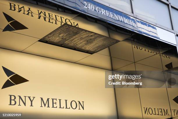 Signage is displayed outside a Bank of New York Mellon Corp. Office building in New York York, U.S., on Saturday, April 11, 2020. Bank Of New York...