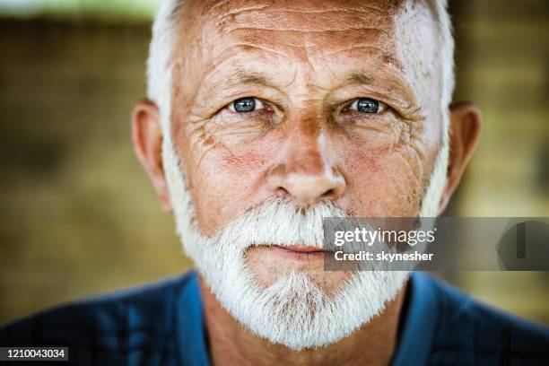 portrait of a senior man. - blue eyes man stock pictures, royalty-free photos & images