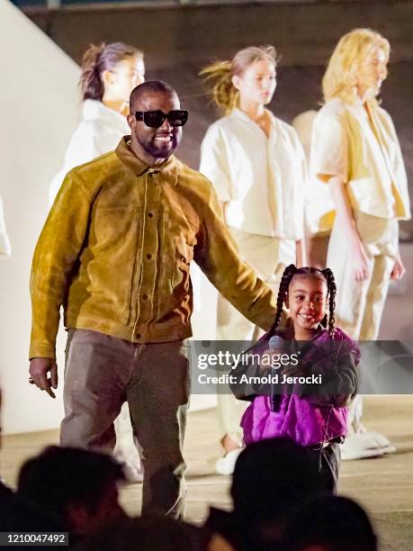 Kanye West and daughter North West attends the "Yeezy Season 8" show as part of the Paris Fashion Week Womenswear Fall/Winter 2020/2021 on March 02,...