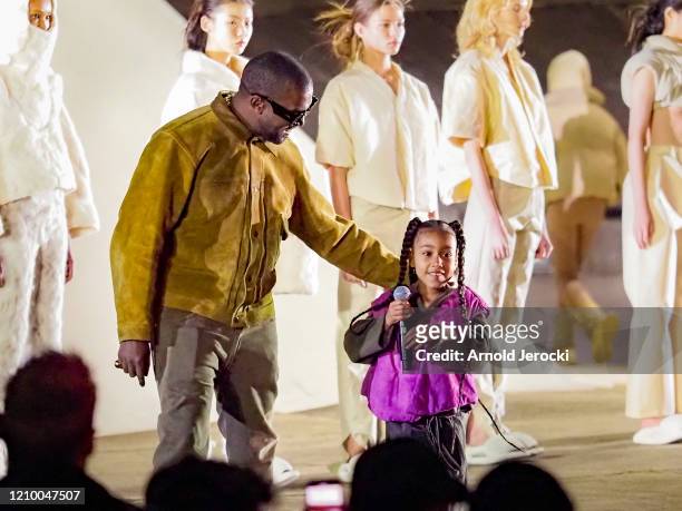 Kanye West and daughter North West attends the "Yeezy Season 8" show as part of the Paris Fashion Week Womenswear Fall/Winter 2020/2021 on March 02,...