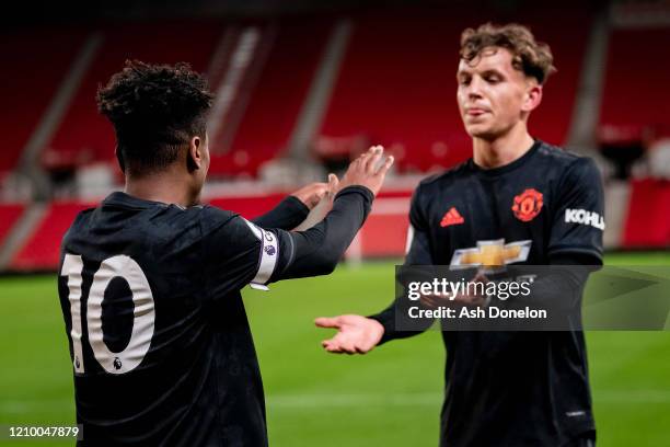 Angel Gomes of Manchester United celebrates scoring their second goal during the Premier League 2 match between Stoke City U23s and Manchester United...