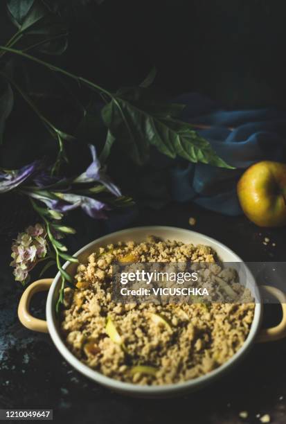 apple crumble in baking pot , still life - cobbler stock pictures, royalty-free photos & images
