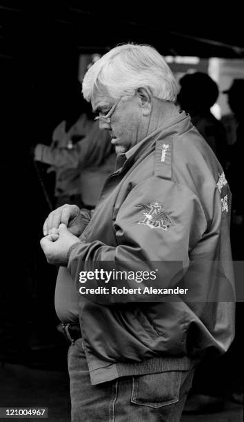 Car owner Junior Johnson pauses in the garage at the Daytona International Speedway prior to the 1987 Daytona 500 on February 15, 1987 in Daytona...