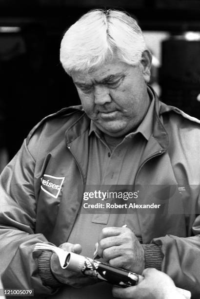 Car owner Junior Johnson pauses in the garage at the Daytona International Speedway prior to the 1987 Daytona 500 on February 15, 1987 in Daytona...