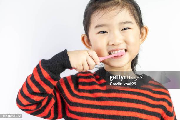 little girl brushing teeth - japanese brush stroke stock pictures, royalty-free photos & images