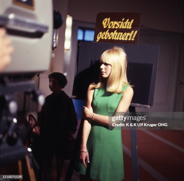 French ye-ye singer France Gall in front of a TV camera on the set of German TV Show 'Vergissmeinnicht', Hamburg, Germany, circa 1965.