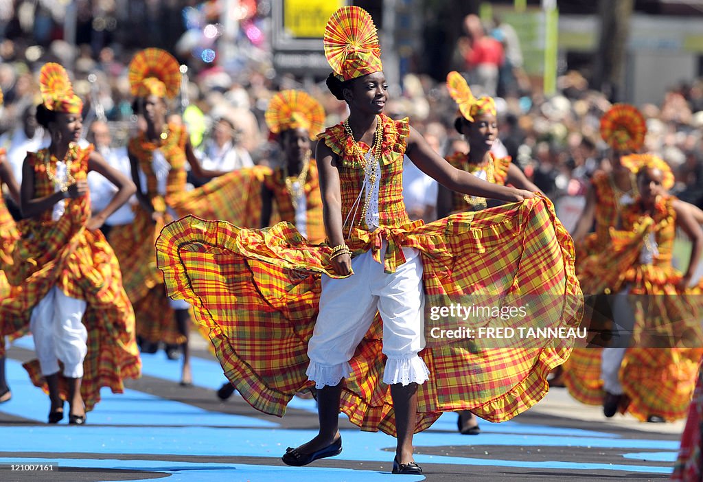 Guadeloupean dancers perform on August 7