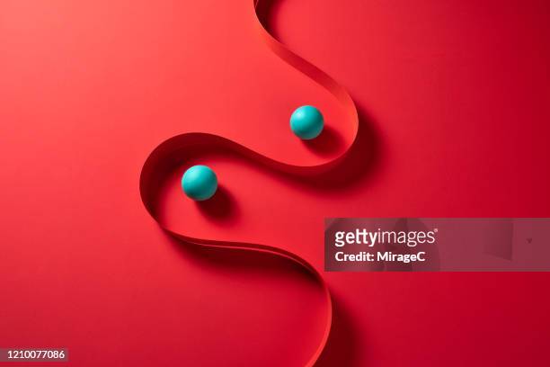 curved paper stripe and spheres - sphere stock pictures, royalty-free photos & images