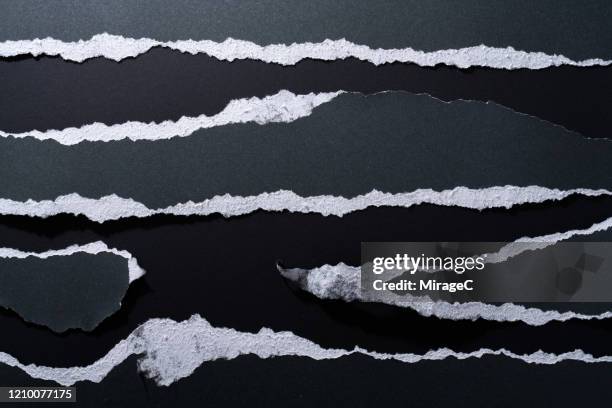 torn paper edge of black paper - paper rip stock pictures, royalty-free photos & images