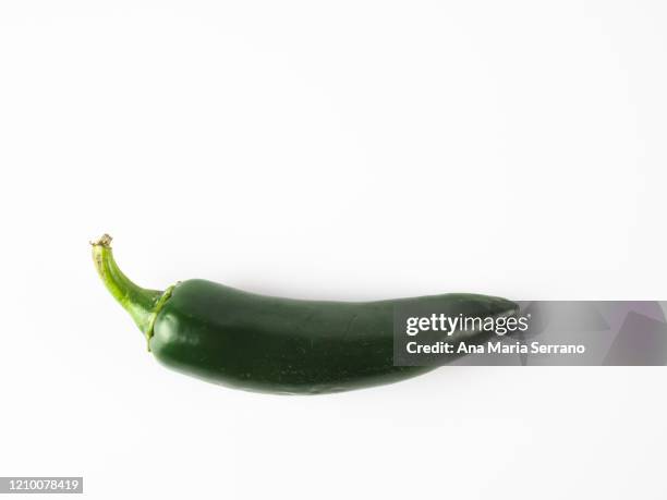 spicy peppers against white background - jalapeño stockfoto's en -beelden