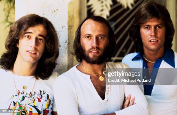 Pop vocal trio The Bee Gees posed together on 13th February 1976. The brothers are, from left, Robin Gibb , Maurice Gibb and Barry Gibb.