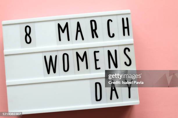 "women's day" message in light box - womens day stockfoto's en -beelden