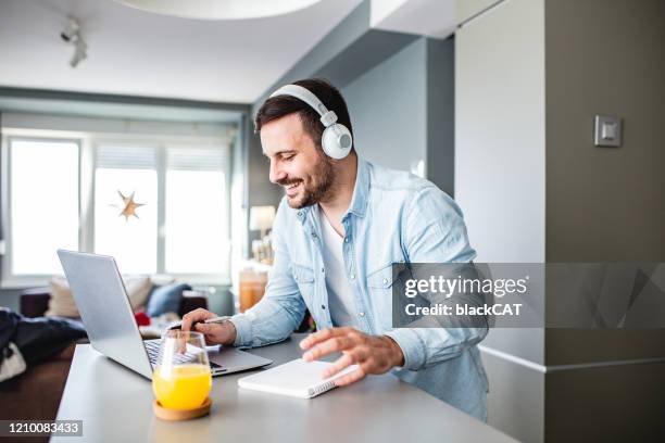 studying with laptop - elearning man stock pictures, royalty-free photos & images