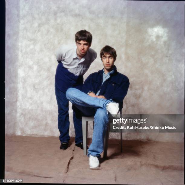 Noel Gallagher and Liam Gallagher of Oasis, at a photoshoot in a hotel in Tokyo, September 1994.