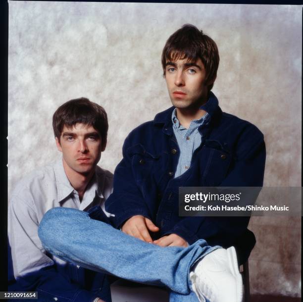 Noel Gallagher and Liam Gallagher of Oasis, at a photoshoot in a hotel in Tokyo, September 1994.