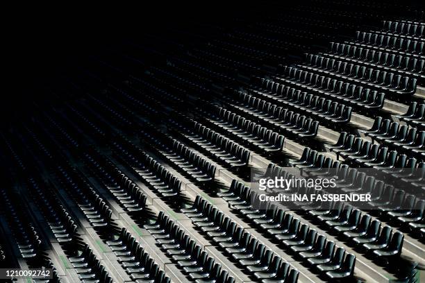 Empty seats are seen at the Borussia Park football stadium in Moenchengladbach, western Germany, on April 16 amid the novel coronavirus COVID-19...