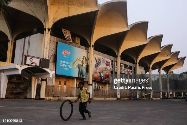 Boy is playing with tire at the deserted Kamalapur Railway Station as the rail department is fully closed for 21 days now to prevent the amid spread...