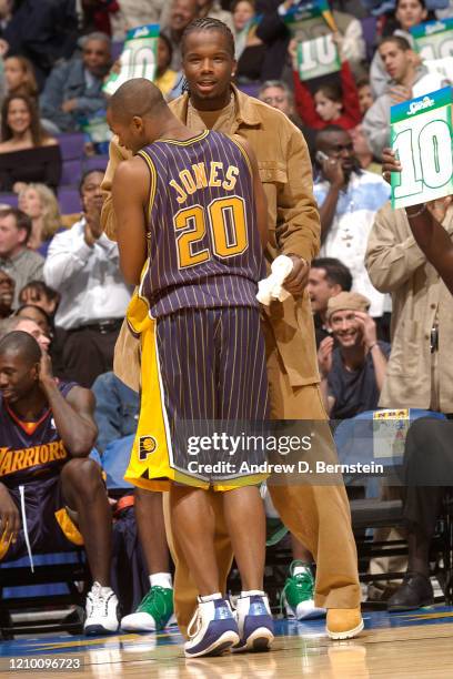 Fred Jones and Jermaine O'Neal of the Indiana Pacer celebrate during the Sprite Rising Stars Slam Dunk Contest at All Star Saturday Night as part of...