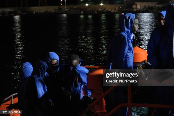 Group of rescued migrants onboard the Spanish vessel at the Malaga harbour on April 15, 2020 in Malaga, Southern Spain. 23 migrants were rescued in...