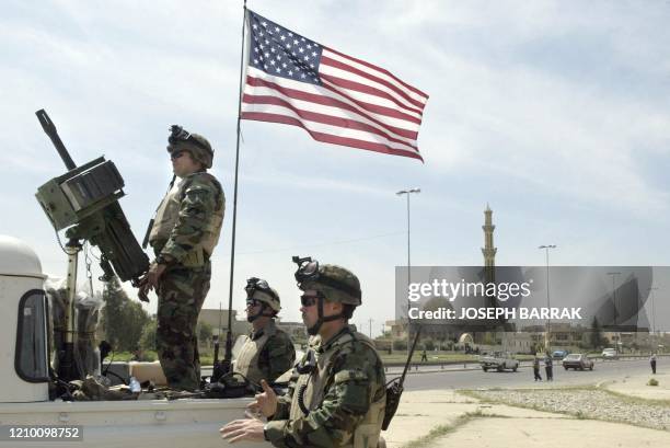 Soldiers man a checkpoint 12 April, 2003 in Mosul, northern Iraq. Looting died down 12 April in Mosul, a strategic base which fell to US-backed...