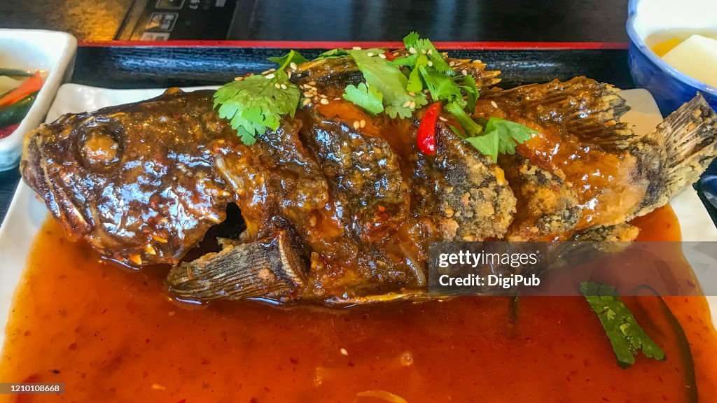 Black rockfish, deep fried and with sauce poured