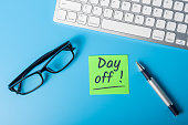 Day off - message on office workplace. Out of office concept