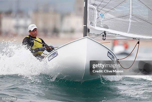 Ben Ainslie of Great Britain in action on his way to a gold medal in the Finn Class medal race on day twelve of the Weymouth and Portland...