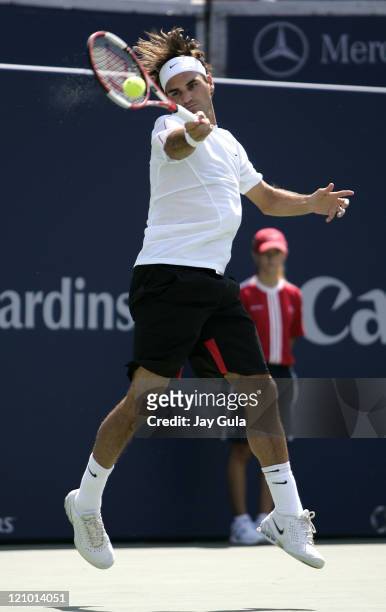 Top seeded Roger Federer of Switzerland in action during his 2nd round match against Sebastien Grosjean of France in the Rogers Cup at the Rexall...