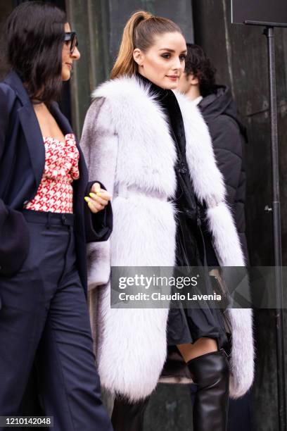 Nausheen Shah and Olivia Palermo, wearing a blue suit and red printed top , and black dress, black boots and light grey fur coat , are seen outside...