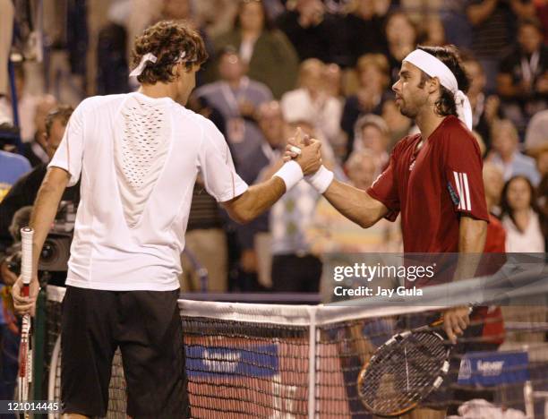 No.1 seed Roger Federer shakes hands with Fernando Gonzalez of Chile after their semi- final match at the Rogers Cup ATP Master Series tennis...
