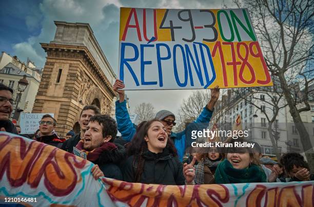 Protestors march through the streets of Paris against the French Government's pension reform bill after French Unions called for a day of National...