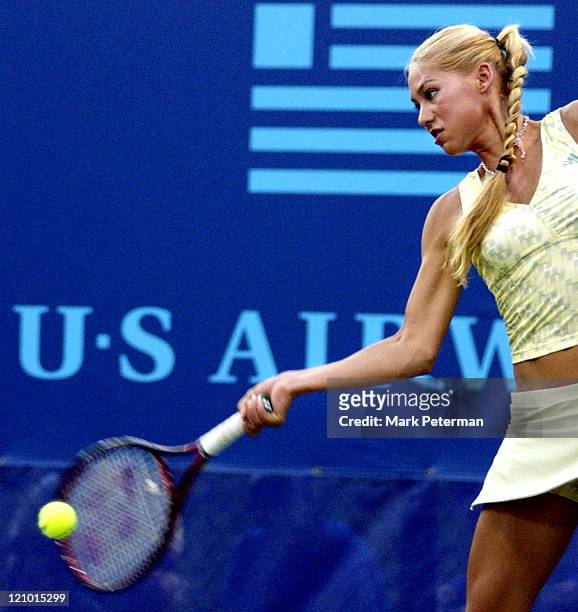 Anna Kournikova hits a forehand while playing womens doubles for the Kansas City Explorers of the World Team Tennis league on the stadium court at...