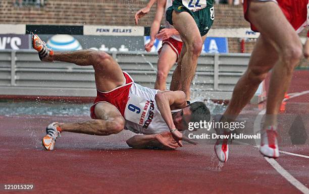 North Carolina State's Gavin Coombs falls during the College Men's Steeplechase Championship Thursday, April 2006 during the 112th running of the...