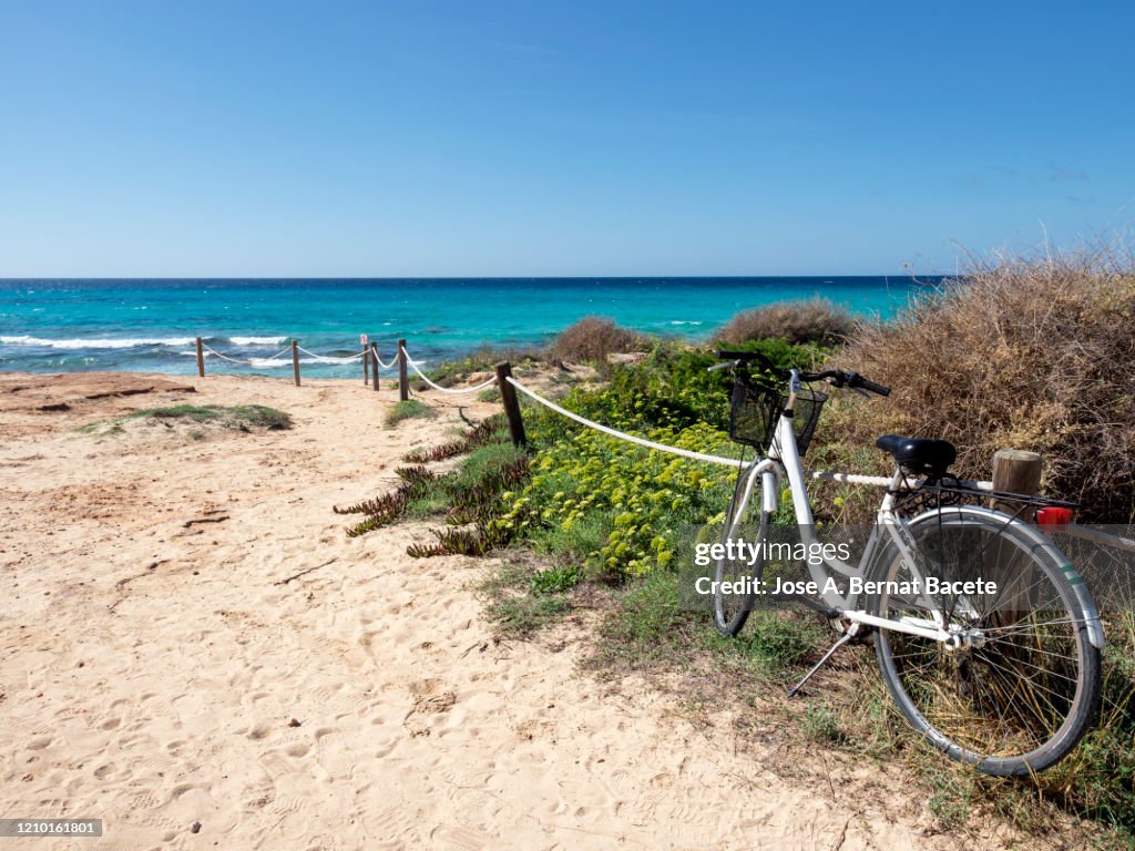 White sand beach against clear blue sky in Formentera island, Spain.
